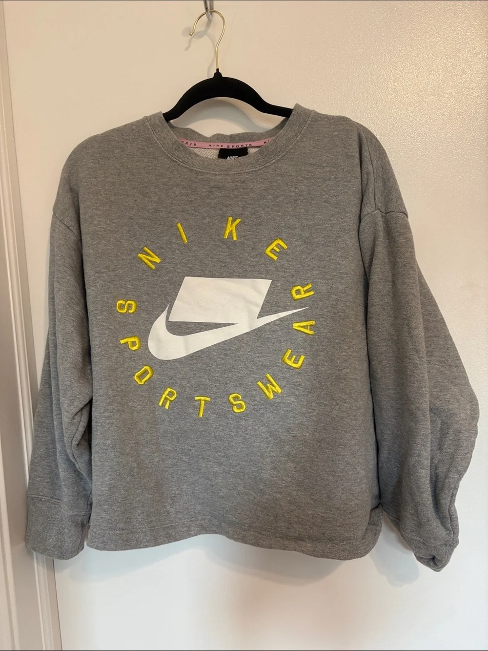 Nike Gray Crewneck Sweatshirt with White Swoosh and Yellow 'Sportswear' Text